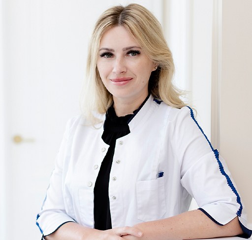 Blonde woman smiling after visiting Morristown dental office