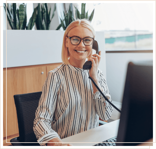 Smiling dental team member talking on phone