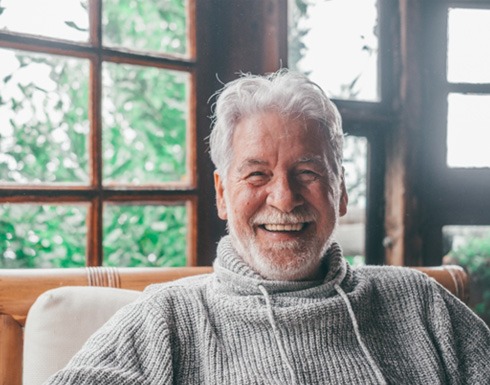 Closeup of senior man smiling at home