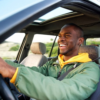 Smiling man drives
