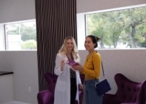 Doctor Henkin laughing with a dental patient