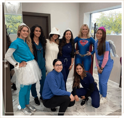 Morristown dental team members dressed in tooth fairy or superhero costumes