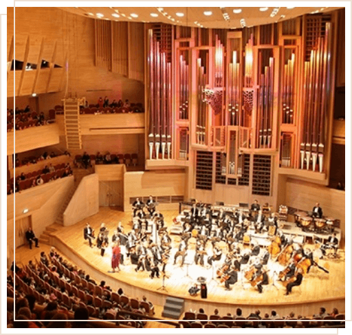 Orchestra performing in auditorium