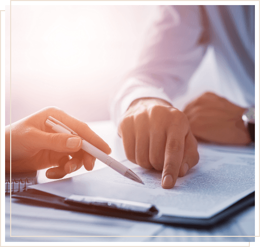 Two people looking at form on clipboard