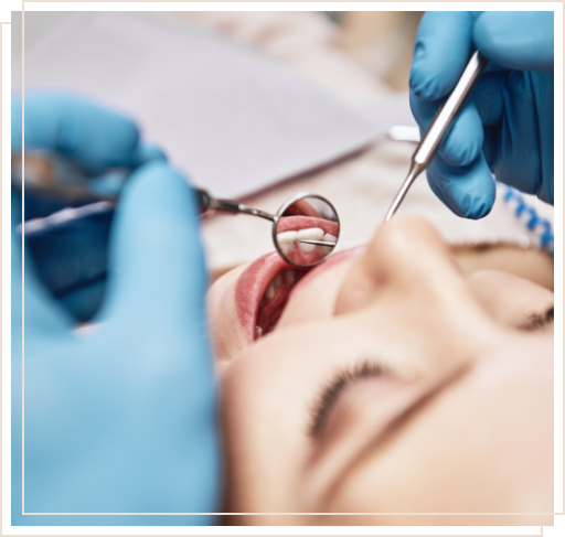 Dentist examining the mouth of a dental patient