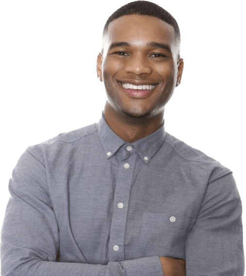 Man in gray shirt smiling after preventive dentistry